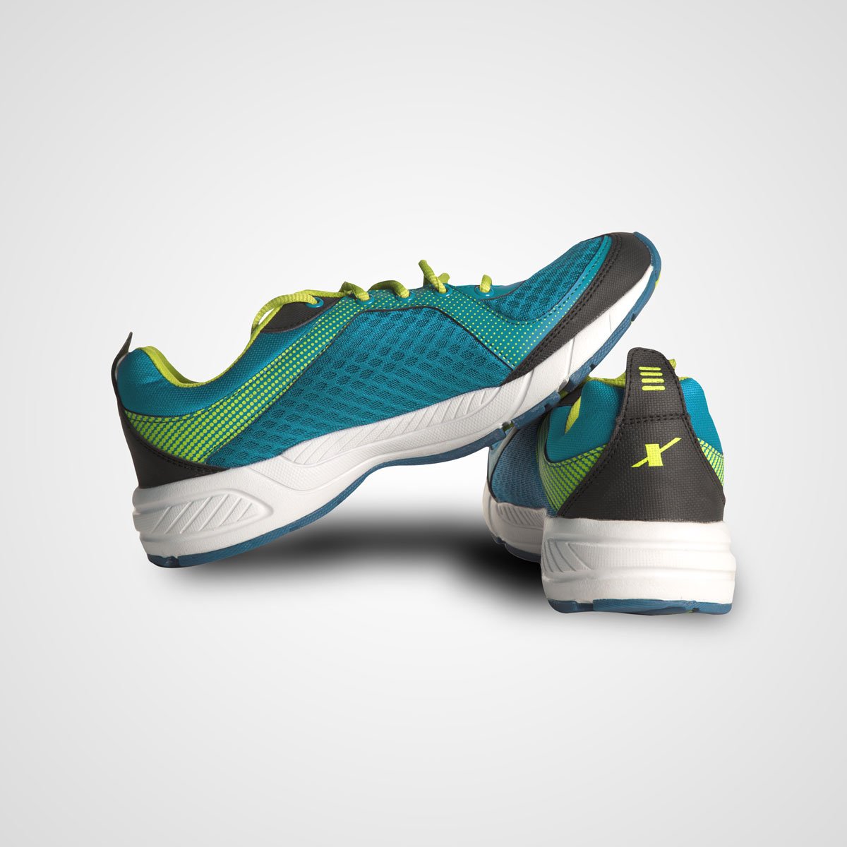 Green and navy athletic-style men’s shoes shown from two angles