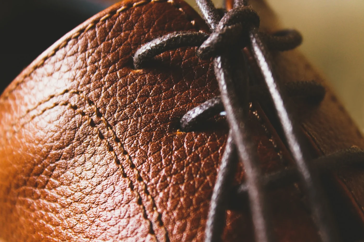 Close-up view of a brown leather shoe showing its surface and finish