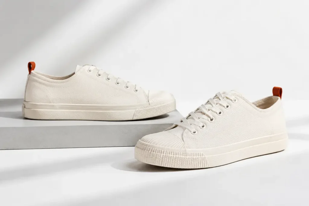 Off-white canvas lace-up shoes shown from two angles