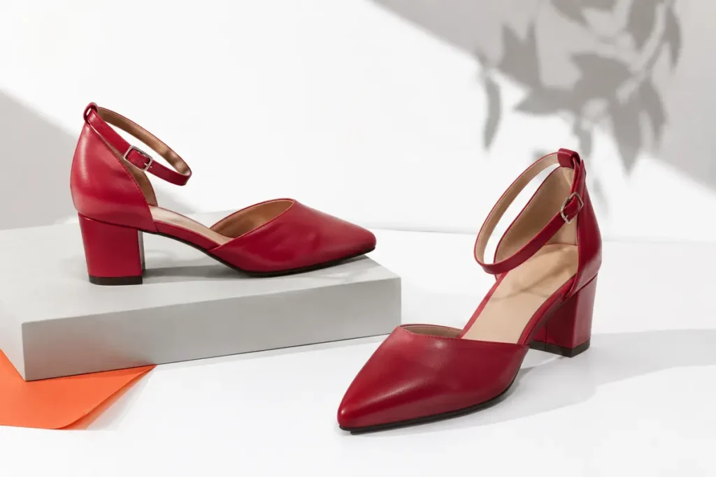 Red mid-height heels arranged as a statement footwear look