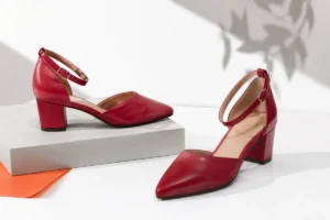Red mid-height heels arranged as a statement footwear look