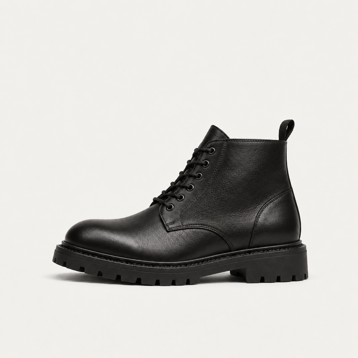Black chunky lace-up boot with a treaded sole, side view
