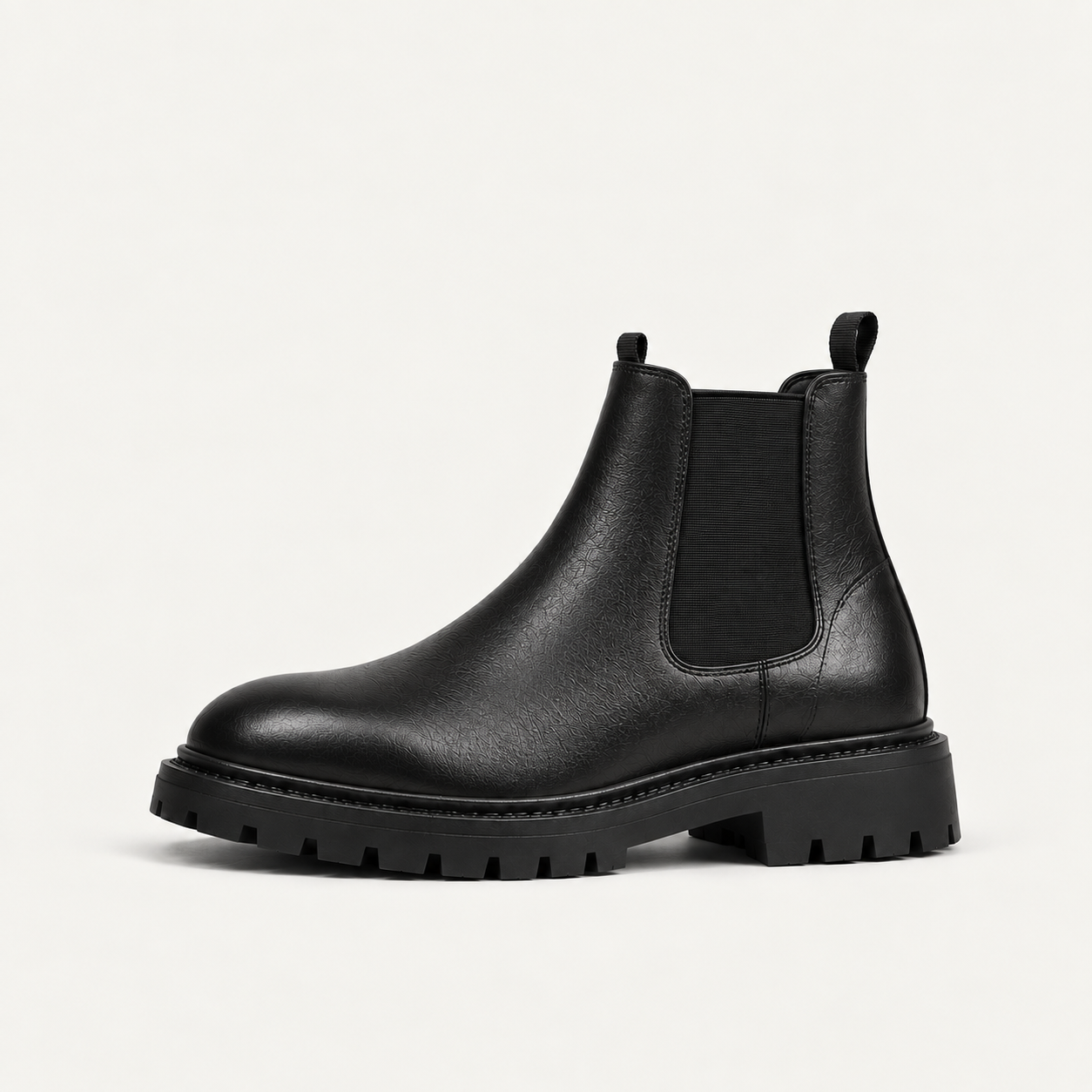 Black chunky Chelsea boot with elastic side panels, side view