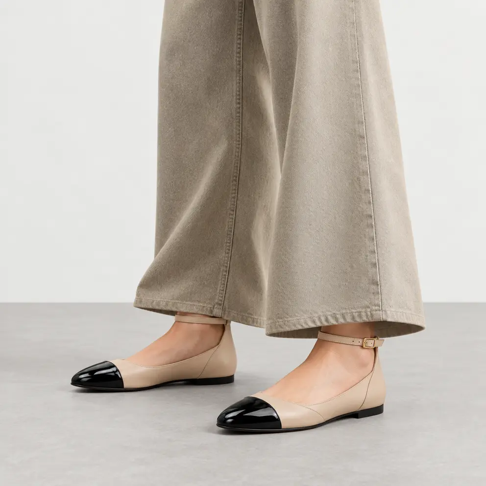 Beige Black Cap-Toe Ankle-Strap Flat worn on foot